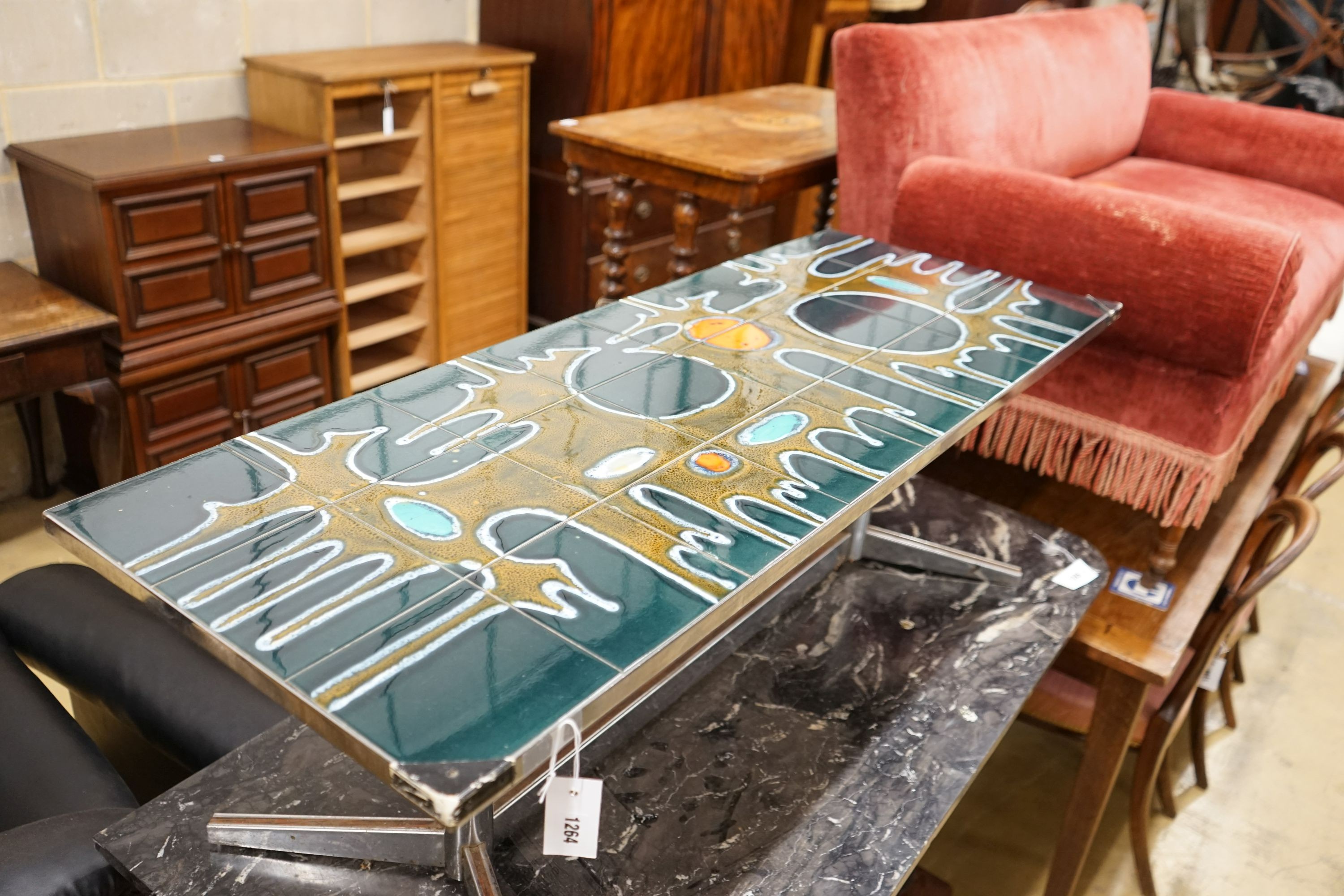 A mid century design tile topped rectangular chrome coffee table, length 121cm, depth 46cm, height 41cm
